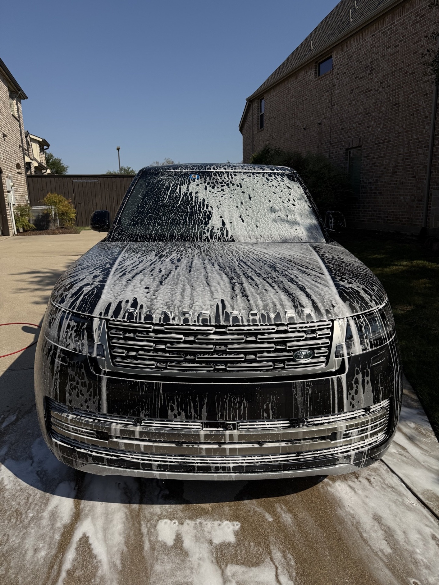 Range Rover front end covered in snow foam