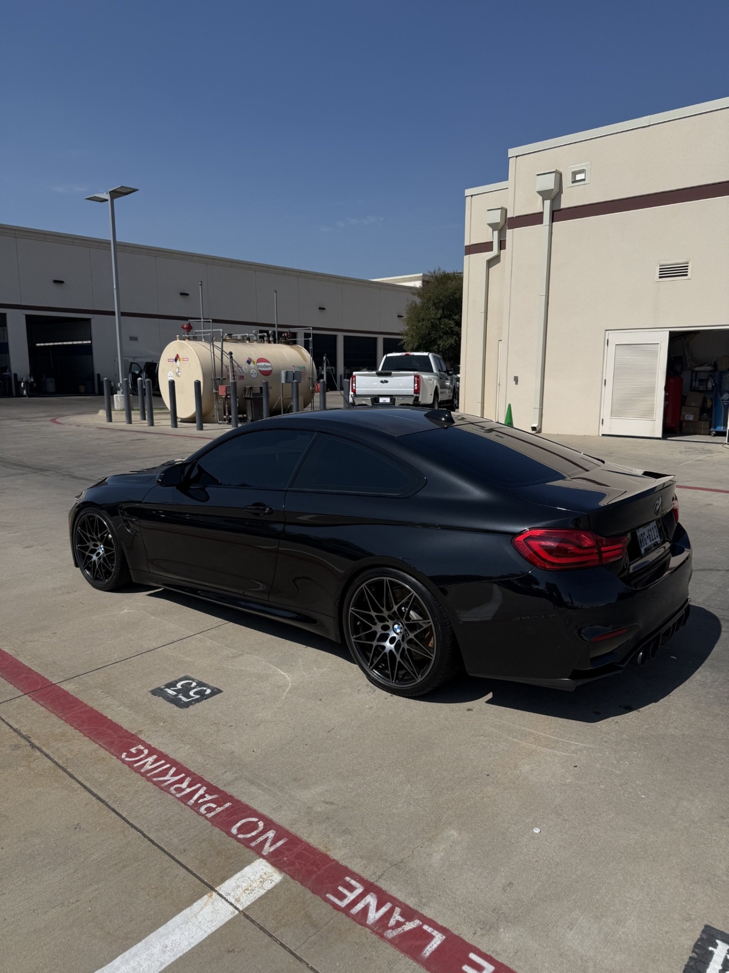 Glossy black BMW M4 after detailing