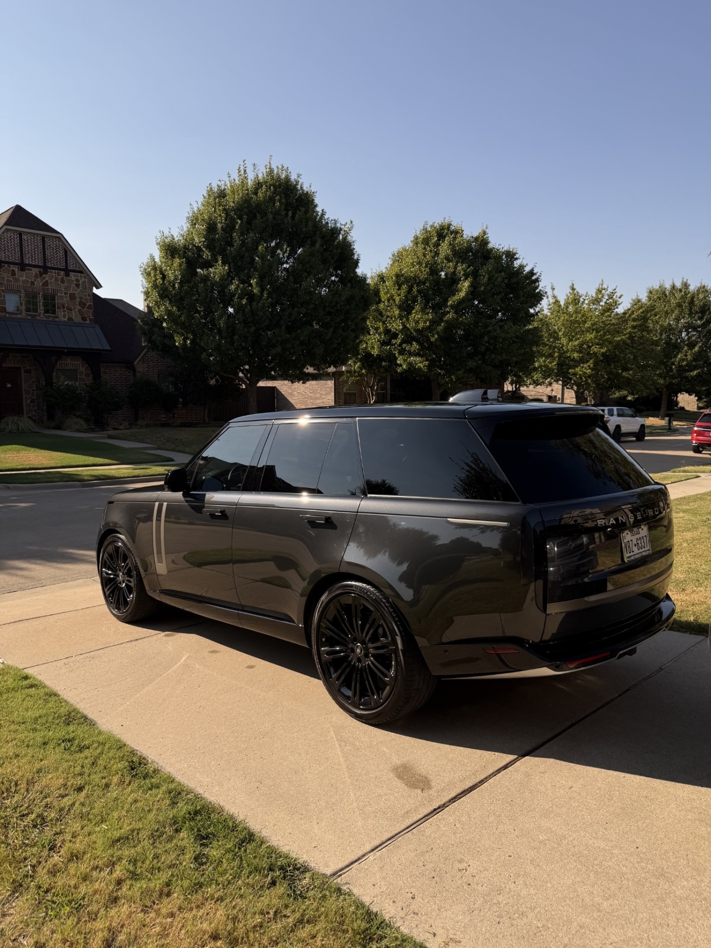 Detailed gray Range Rover parked curbside